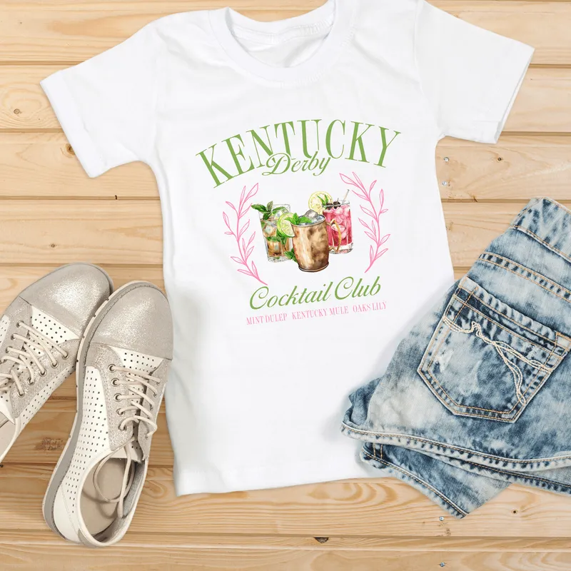 Kentucky Derby Cocktail Club tee laid flat with denim shorts
